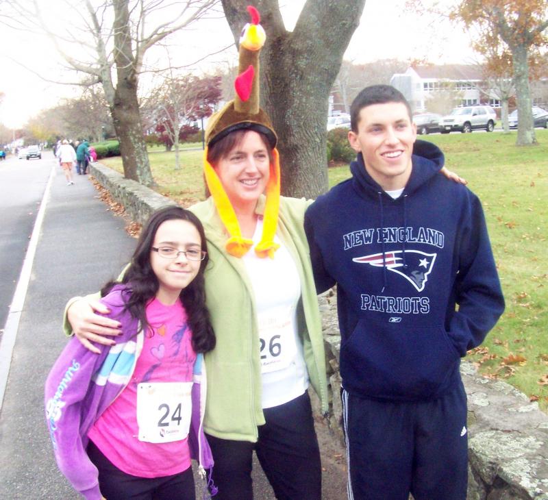 From left, Alyssa Fornaro, Trina Ayan and Mike Ayan get ready to run in their first Turkey Trot. BY MATTHEW BERNAT